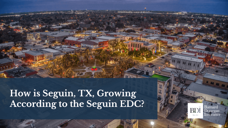 Aerial view of downtown Seguin, Texas, lit up at night, showcasing the city’s growth and vibrant community.